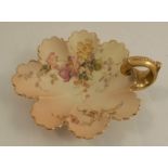 A Royal Worcester blush ivory shell shaped dish, decorated with flowers, having a gold handle, shape