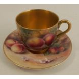 A Royal Worcester miniature coffee cup and saucer, decorated with hand painted fruit by Rushton