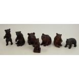 Seven various Black Forest carved models, of bears in various poses, height 4.25ins and down