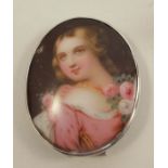 Four framed oval porcelain plaques, three decorated with still lives of flowers and the fourth