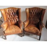 A pair of Georgian style button back leather wing armchairsCondition Report: Images are now on-line.