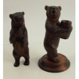 Two Black Forest carved models, of standing bears, one holding a barrel, height 7ins and down