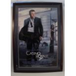 A framed and signed Casino Royal poster, with Daniel Craig as James Bond 007, 40ins x 24.5ins, glass