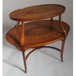 A two tier Edwardian etager, in satinwood and mahogany, raised on outswept legs and covered in