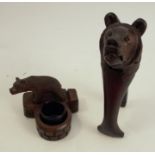 A pair of Black Forest carved nutcrackers, carved with a bear's head, together with a Black Forest