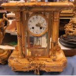 A three piece marble and gilt metal clock garniture, the clock of architectural form, stamped Mougin