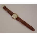 Thomas Russell & Son, a gentleman's 9 carat gold mechanical wrist watch, the circular white dial