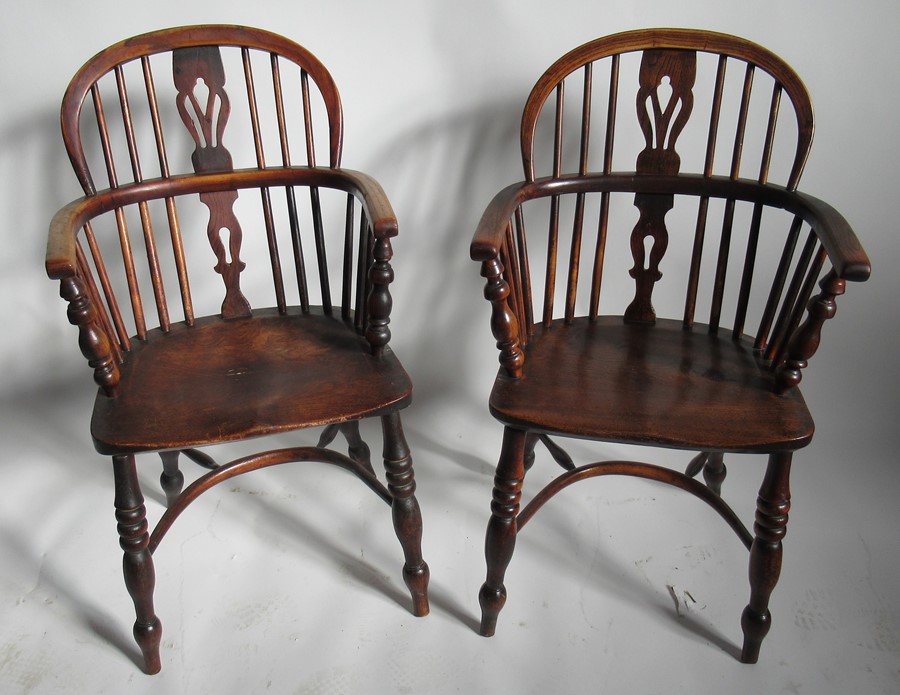 A pair of Antique Windsor armchairs, with elm seats and crinoline stretchersCondition Report: Height