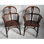 A pair of Antique Windsor armchairs, with elm seats and crinoline stretchersCondition Report: Height