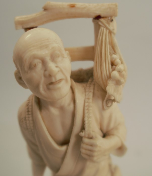 A 19th century carved ivory figure, of an Eastern man with harvested crops on his back, signed to - Image 3 of 6