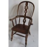 An Antique Windsor armchair, with pierced splat and H stretcher