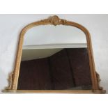 A pine framed over mantel mirror, with shell and scroll decoration, 46ins x 53ins overall
