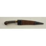 An Antique dagger and scabbard, the wooden handle with wire work grip, the wooden scabbard with