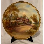 A Royal Worcester plate, decorated with a view of Anne Hathaway's cottage, by Raymond Rushton, circa