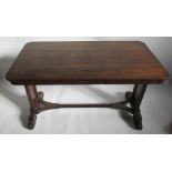 A 19th century rosewood centre table, having turned legs raised on four paw feet, united by a