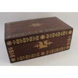 A 19th century rosewood and cut brass writing box, with decoration to the front and top, the