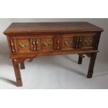 An oak dresser, having fitted two moulded front drawers, and raised on square moulded legs, width