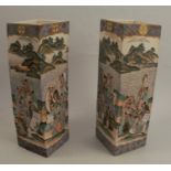 A pair of Japanese satsuma vases, of square section, decorated with groups of artists and