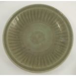 A Chinese celadon shallow bowl, with fluted decoration, diameter 16insCondition Report: One inch rim