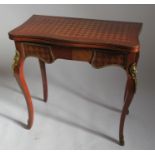 A swivel topped card table, with parquetry inlay and gilt metal mounts, raised on cabriole legs,