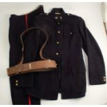 A Wiltshire Regiment navy tunic jacket and trousers, together with leather Sam Brown military belt