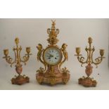 A 19th century French gilt metal and marble clock garniture, the striking movement (bell missing)