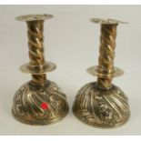 A pair of 17th century style brass candlesticks, having spirally turned column with drip tray, and