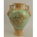 A Royal Worcester vase, with blush ivory neck, handles and foot, the body decorated with gilt to a