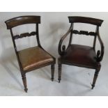 A set of 7 early 19th century mahogany dining chairs, having a carved back, turned legs and