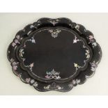 A 19th century Jennens & Bettridge black papier mache tray, of oval form with shaped edge, having