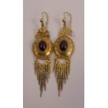 A pair of Victorian gold garnet set drop earrings. Total length 2.5ins, length excluding ear hook,