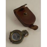 A Negretti & Zambra brass cased compass, with mother of pearl dial, together with a leather case