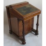 An unusual Victorian davenport, having lid opening to reveal stationery compartment with