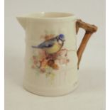 A Royal Worcester rustic jug, decorated with a blue tit by William Powell, 1924, height 2.