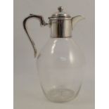 A silver mounted and glass claret jug, with plain glass body and star cut base, London 1927, maker