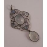 A moonstone pendant, the C scroll frame set with five cabochons, and a drop beneath, 6cm long