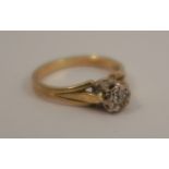 An 18 carat gold illusion set single stone diamond ring, finger size N, 3.5g gross