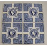 A set of four Josiah Wedgwood & Sons tiles, decorated in blue and white with a classical design,