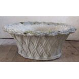 An oval reconstituted stone planter, with moulded basket weave body, diameter 20ins