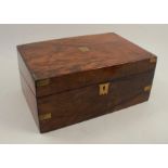 A 19th century walnut writing box, with brass inlaid corners, the interior with inset leather