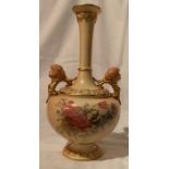 A Royal Worcester blush ivory vase, decorated with flowers, having two gilt mask handles, shape