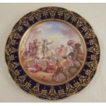 A 19th century Serves porcelain cabinet plate, decorated with a battle scene, to a jewelled