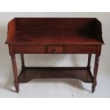 A 19th century mahogany wash stand, with a high tray back, fitted with a short central drawer and