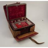 A 19th century rosewood and cut brass travelling vanity box, with decoration to the top and front,