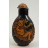 An oriental style carved overlay scent bottle, decorated with figures, height 2.75ins