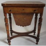 A 19th century walnut fold over games table, the top having a chequerboard inlay, with drawer and