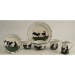 The Bristol Cat & Dog Pottery, a group of tea wares decorated by Louis Wain with black cats and dogs