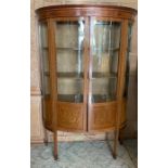 An Edwardian mahogany D shaped display cabinet, with satinwood cross banding and marquetry panels,