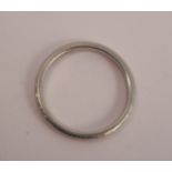 A patterned ring, stamped 'Platinum', finger size L, 3.3g gross