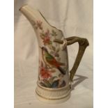 A 19th century Royal Worcester horn jug, decorated with a bird in foliage, shape number 1116, height